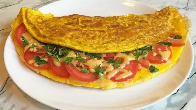 Вкусный завтрак: как приготовить небанальный омлет?